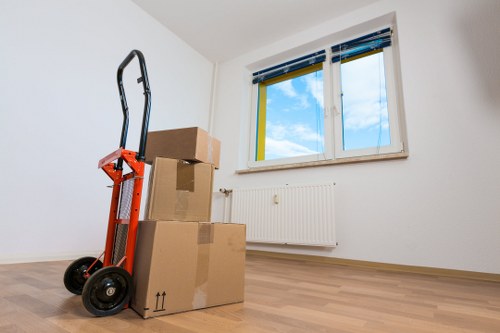 Carefully arranged furniture items in a secure storage unit in Southall