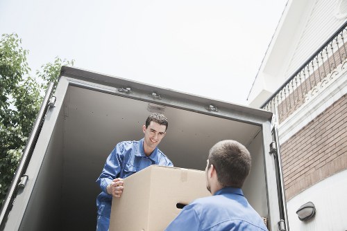 Professional movers loading furniture for a Southall relocation
